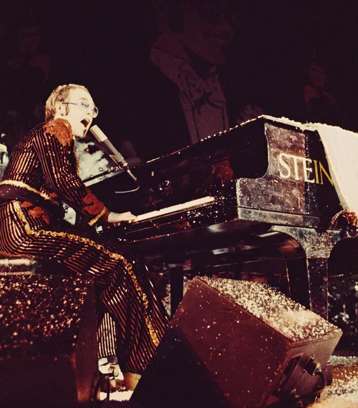 British singer Elton John performs on stage during his Christmas show at the Hammersmith Odeon in London, UK, 21st December 1973. (Photo by )